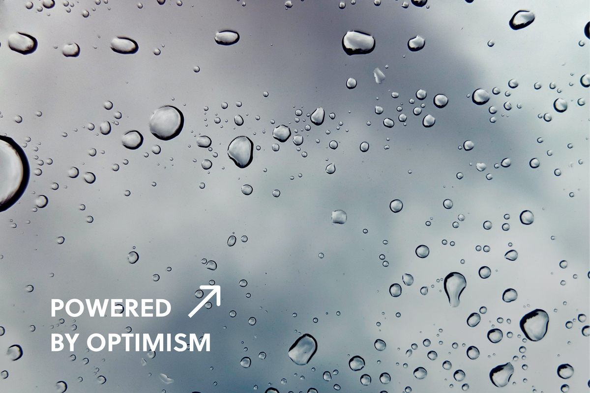 Close up of water droplets on a grey surface