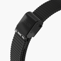Close up image of the clasp of a black stainless steel mesh strap from Solios