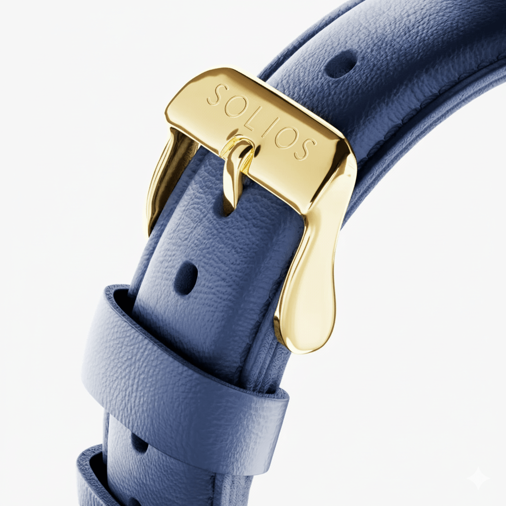 Close up view of the gold buckle on a blue eco vegan leather strap from Solios