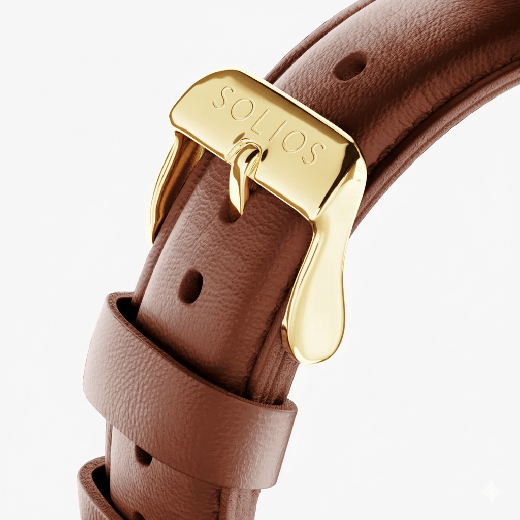 Close up view of the gold buckle on the brown eco vegan leather strap from Solios