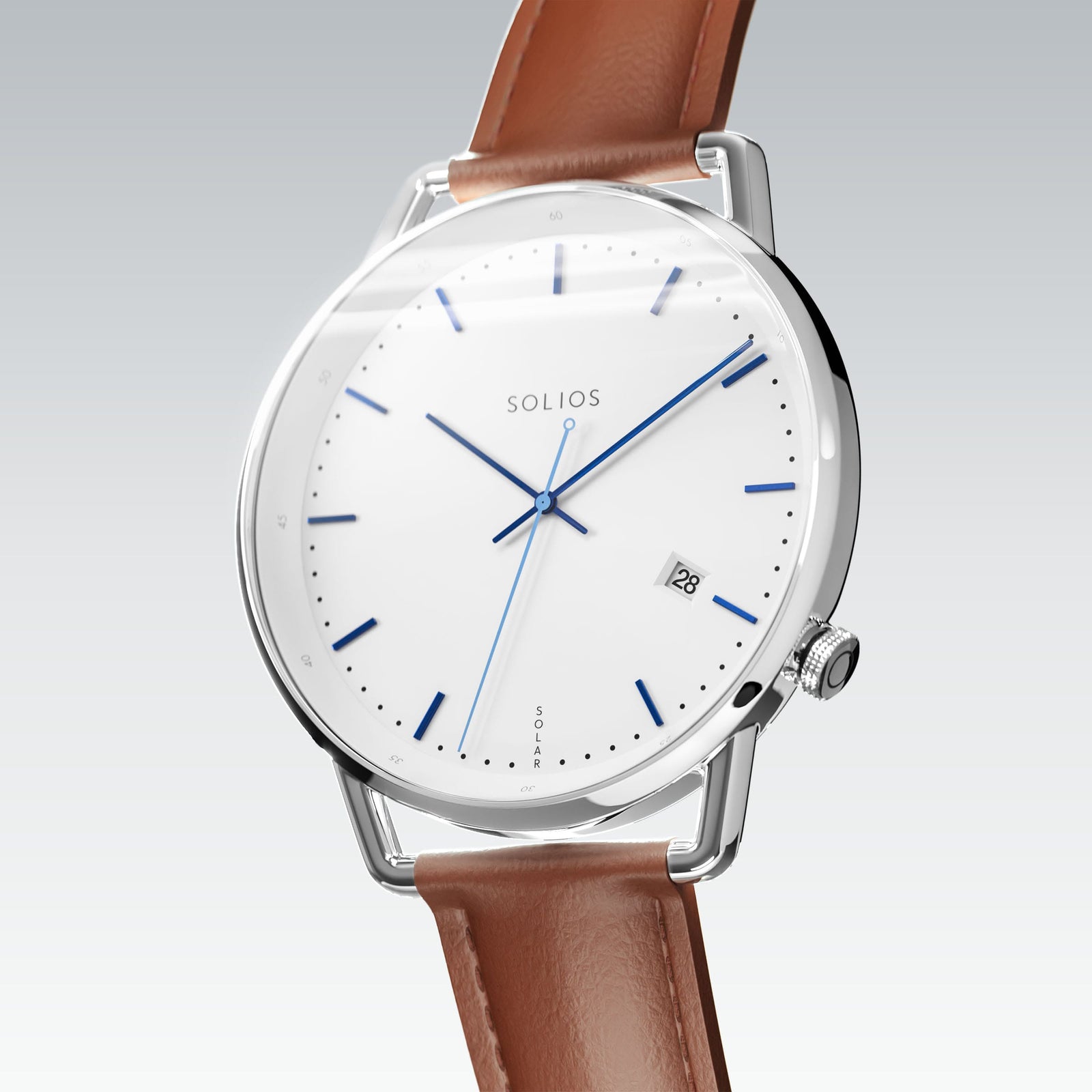 Solios Solar Curve, white dial and silver case, at a three-quarter angle, blue hands and indices, date calendar, curved sapphire crystal, brown vegan leather strap