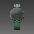 Solios Solar Curve watch, black dial and mat black 40mm case, on a green vegan leather strap, front view