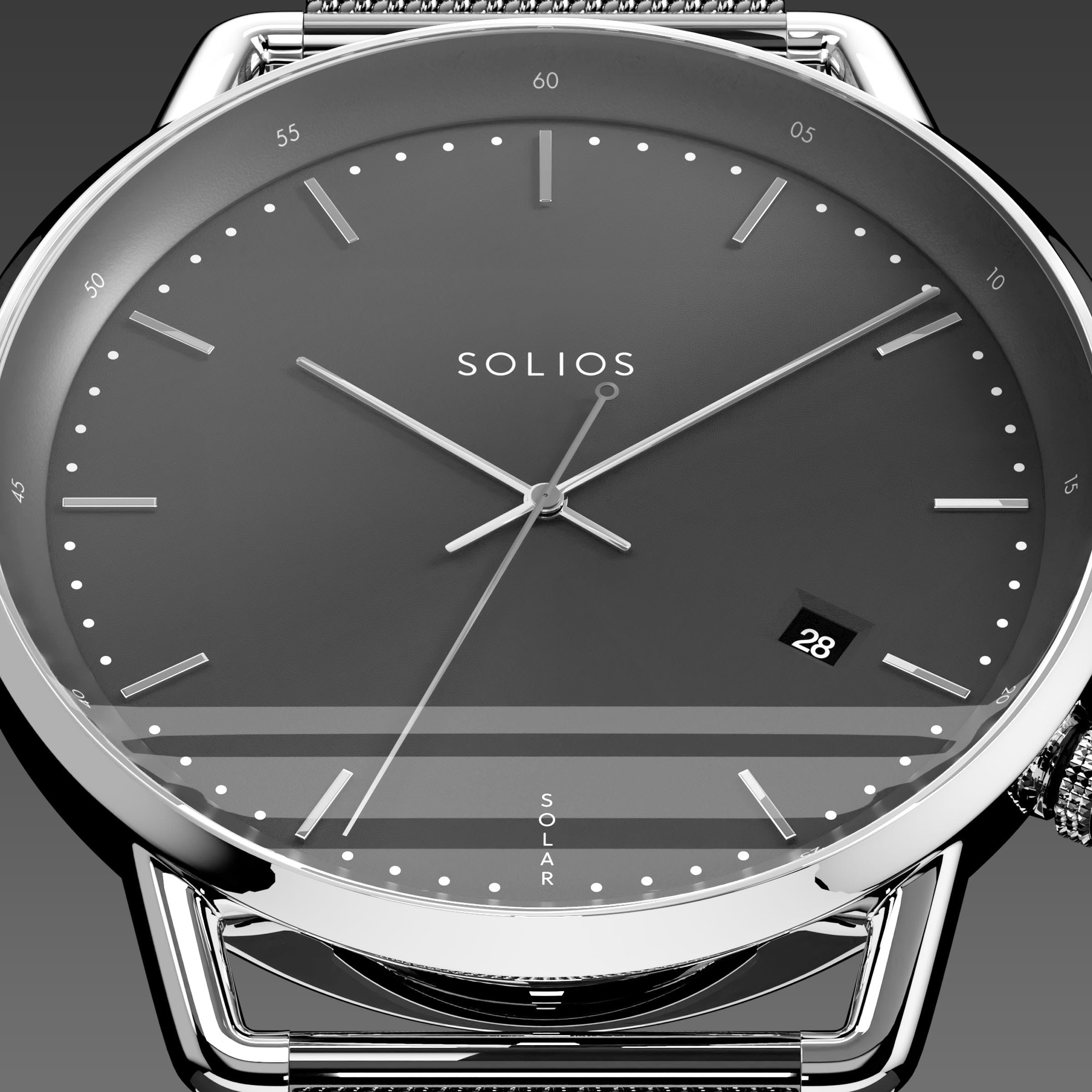 Close-up of the Solios Solar Curve black dial with silver hands, date and SOLAR text, grey mesh metal strap