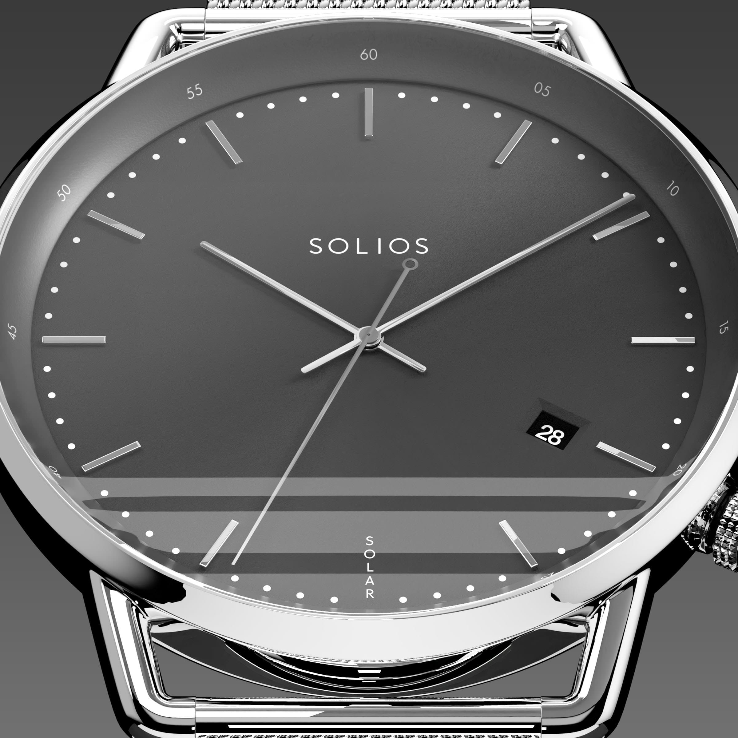 Close-up of the Solios Solar Curve black dial with silver hands, date and SOLAR text, silver mesh metal strap