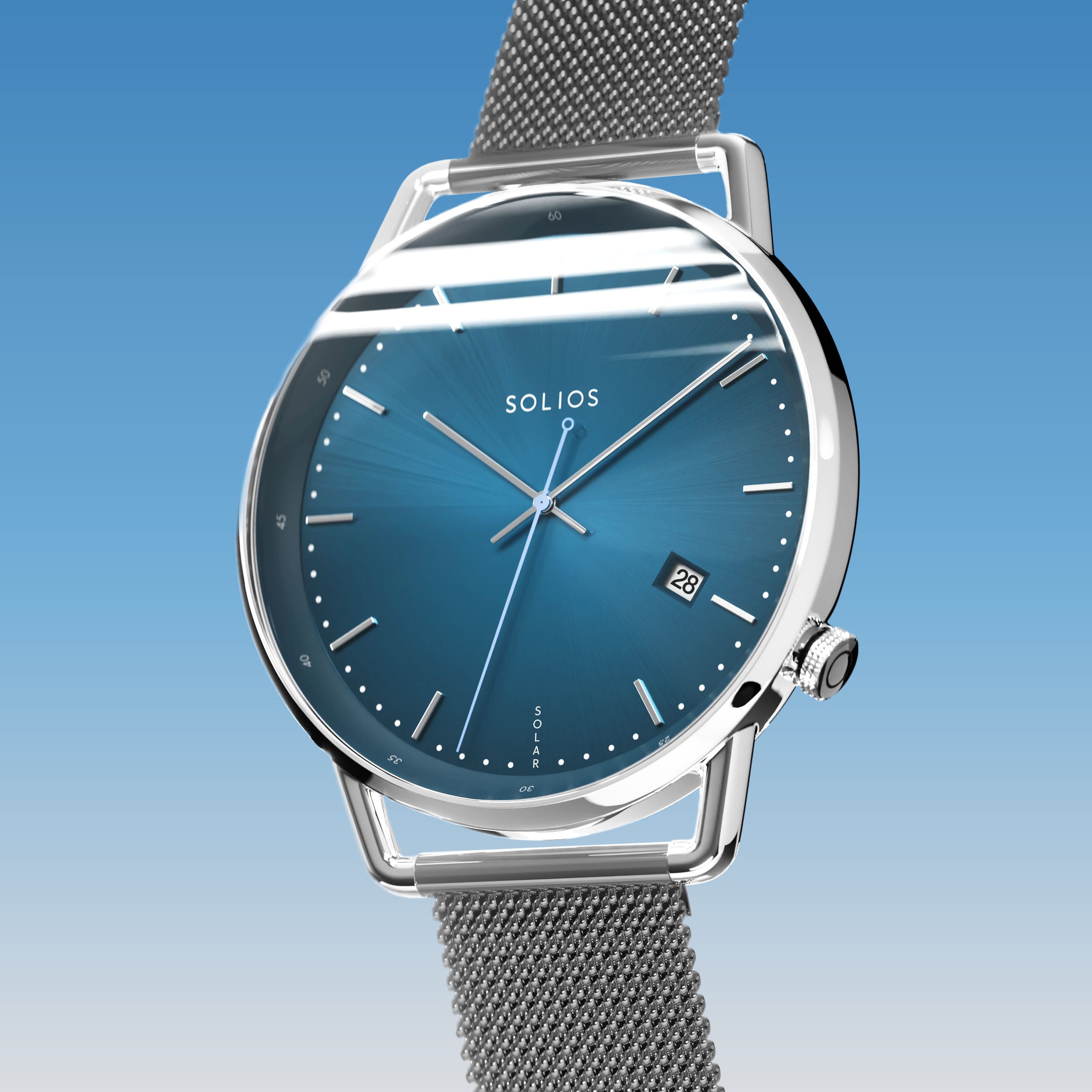 Solios Solar Curve, blue dial and silver case, at a three-quarter angle, silver hands and indices, date calendar, curved sapphire crystal, grey mesh metal strap
