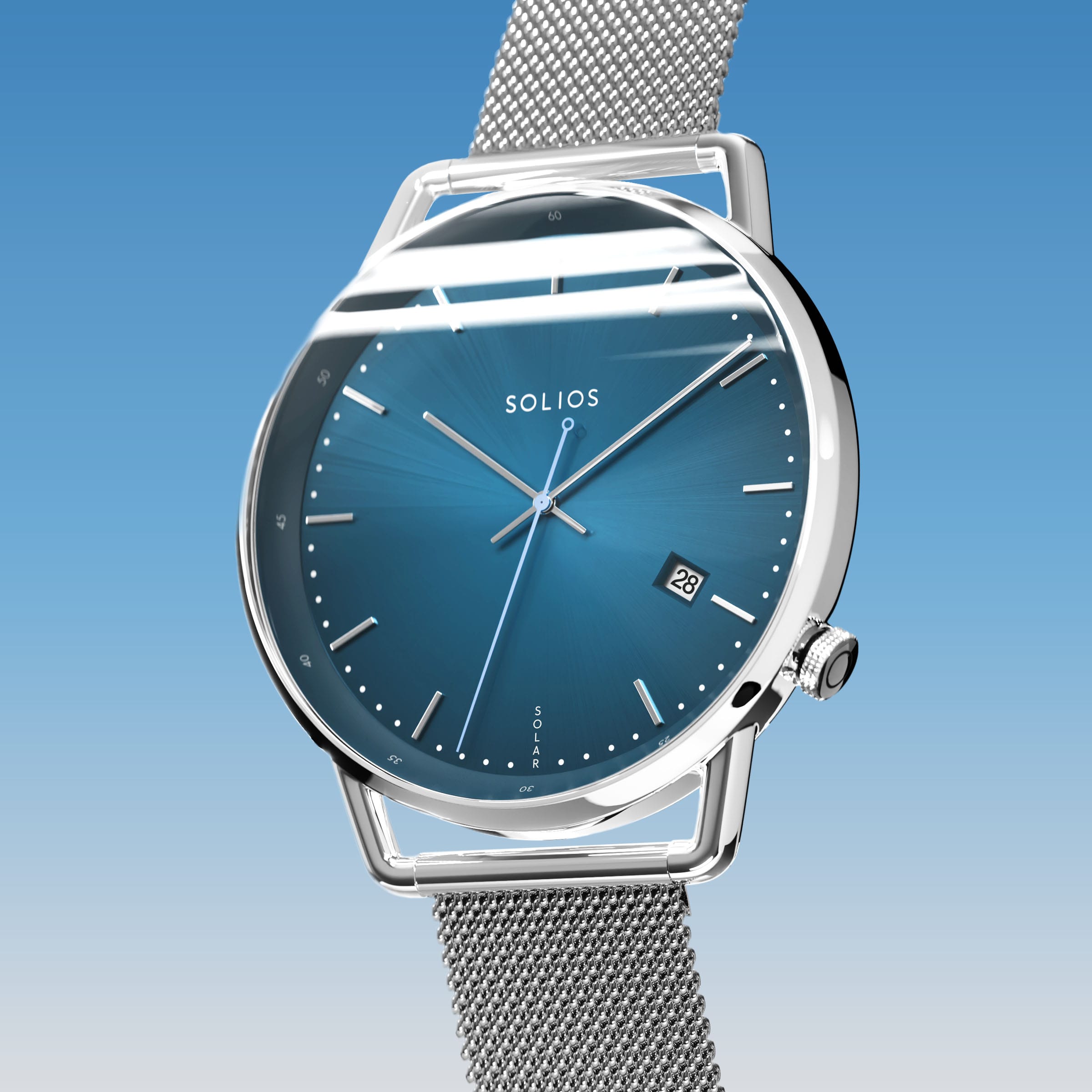 Solios Solar Curve, blue dial and silver case, at a three-quarter angle, silver hands and indices, date calendar, curved sapphire crystal, silver mesh metal strap