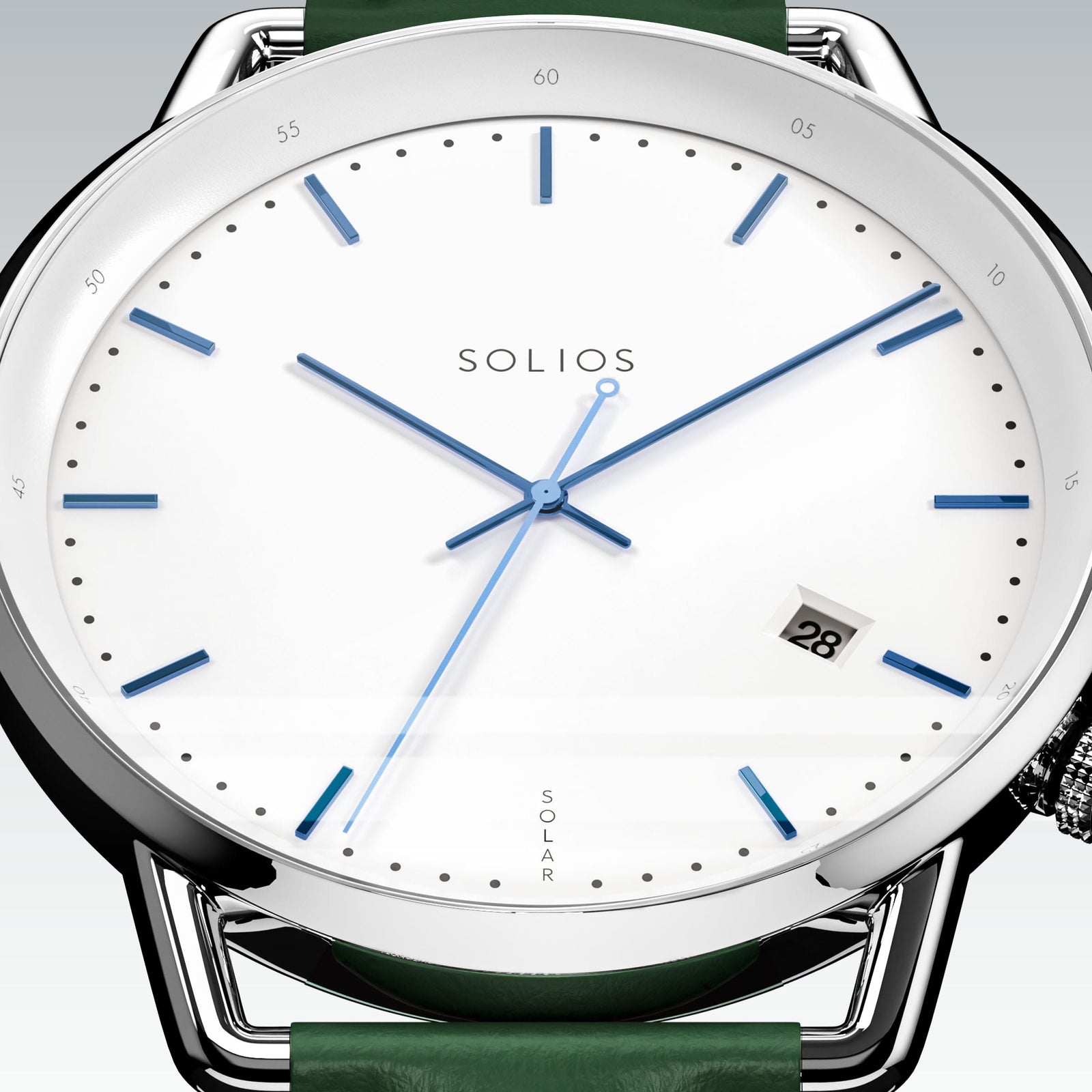 Close-up of the Solios Solar Curve white dial with blue hands, date and SOLAR text, green vegan leather strap