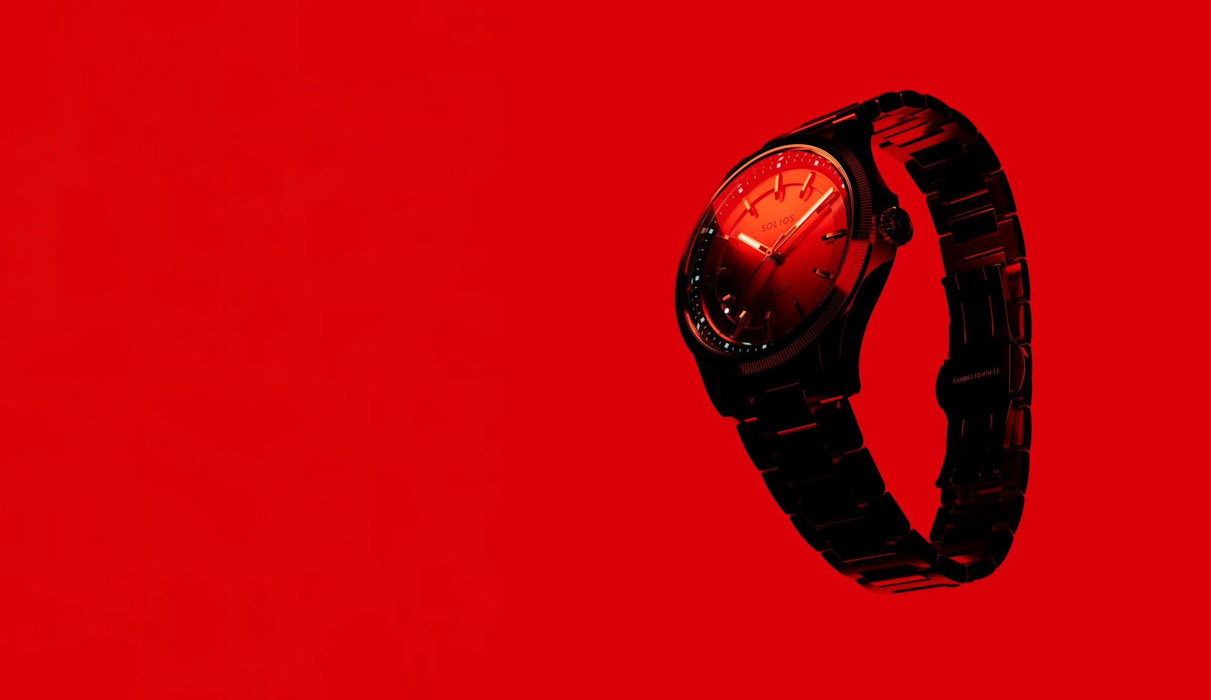 Solios Sunseeker solar watch, black dial and steel bracelet, on a red background