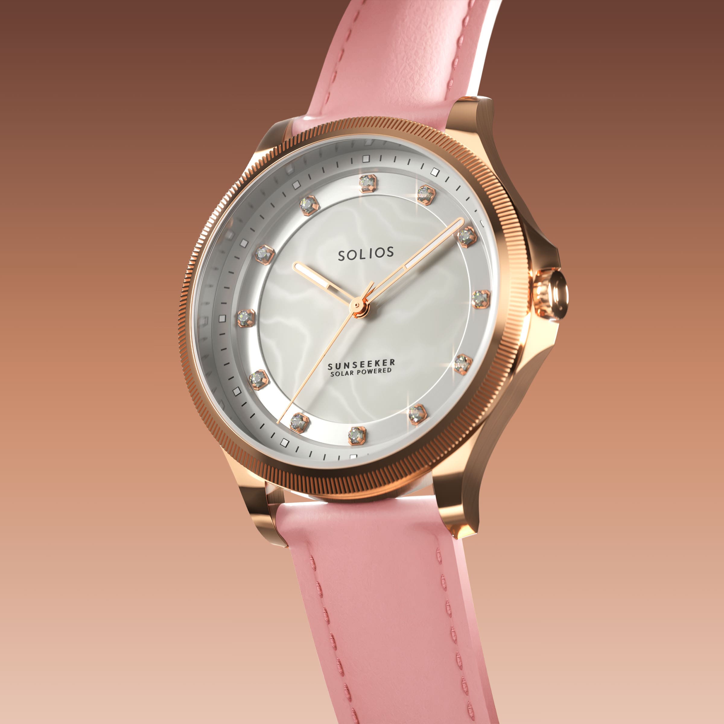 Angled view of the Sunseeker 34mm solar watch, mother of pearl dial with crystal hour markers and rose gold case on a pink eco vegan leather strap