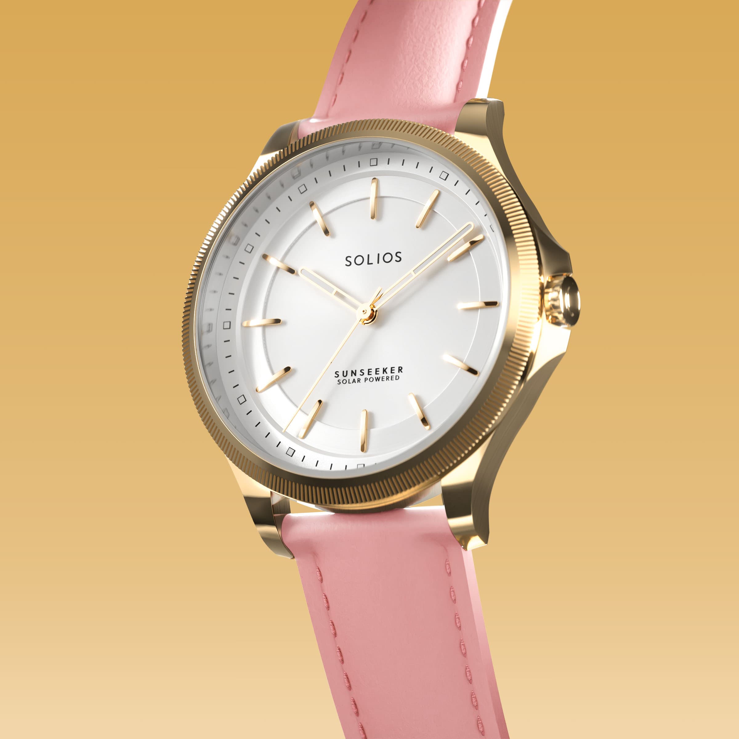 Angled view of the Sunseeker 34mm solar watch, white dial and gold case on a pink eco vegan leather strap