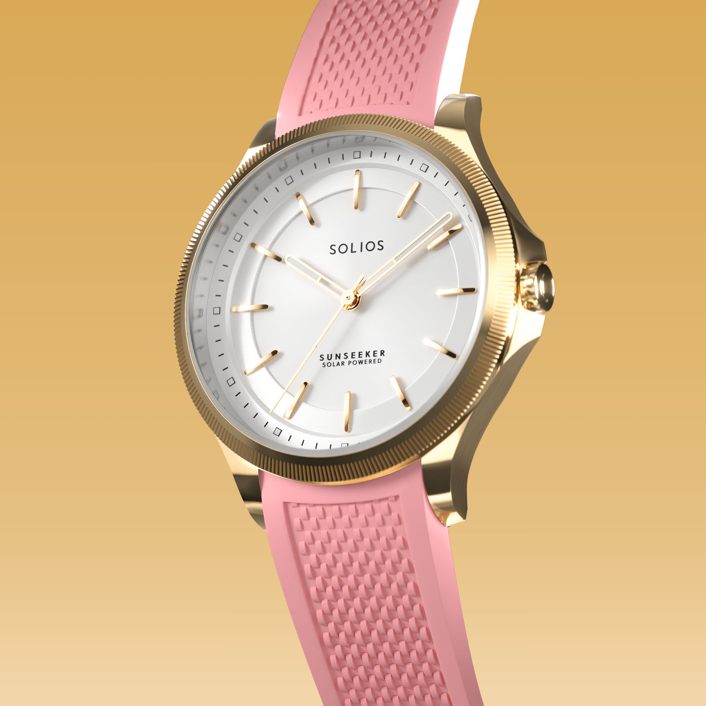 Angled view of the Sunseeker 34mm solar watch, white dial and gold case on a pink natural rubber strap